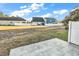 Spacious backyard featuring a patio and white fence that borders other homes in a shared community at 626 Lorenzo Dr. # 626, North Myrtle Beach, SC 29582