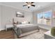 Cozy bedroom with a ceiling fan, a comfortable bed, and a window letting in natural light at 626 Lorenzo Dr. # 626, North Myrtle Beach, SC 29582