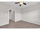 This bedroom features neutral walls and carpeting, a ceiling fan, and an adjacent door to another room at 626 Lorenzo Dr. # 626, North Myrtle Beach, SC 29582