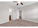 Bedroom with neutral walls and carpet features an open doorway to an adjoining bathroom and hallway at 626 Lorenzo Dr. # 626, North Myrtle Beach, SC 29582