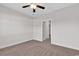 Spacious bedroom features neutral walls, carpet, ceiling fan, and an open doorway to an adjoining room at 626 Lorenzo Dr. # 626, North Myrtle Beach, SC 29582