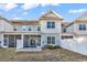 Back exterior of home featuring screened porch and patio, complemented by a neatly fenced yard at 626 Lorenzo Dr. # 626, North Myrtle Beach, SC 29582