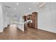 Open-concept kitchen with a large island, stainless steel appliances, and wood flooring flowing into the living area at 626 Lorenzo Dr. # 626, North Myrtle Beach, SC 29582