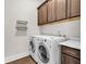Convenient laundry room with wooden cabinets and modern appliances at 626 Lorenzo Dr. # 626, North Myrtle Beach, SC 29582