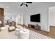 Bright living space with wood floors, white walls, and a modern entertainment center. The open floor plan is ideal for hosting at 626 Lorenzo Dr. # 626, North Myrtle Beach, SC 29582