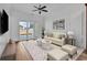Cozy living room with plush seating, neutral decor, and sliding glass doors leading to an outdoor patio at 626 Lorenzo Dr. # 626, North Myrtle Beach, SC 29582