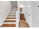 Staircase with wood steps and white risers leading to the second floor at 626 Lorenzo Dr. # 626, North Myrtle Beach, SC 29582