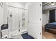 Bathroom featuring large, tiled walk-in shower with glass door, toilet and view to the bedroom at 775 Oyster Bluff Dr., Myrtle Beach, SC 29588