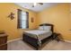 Cozy bedroom with yellow walls, a ceiling fan, and a comfortable bed with decorative pillows at 775 Oyster Bluff Dr., Myrtle Beach, SC 29588