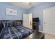 Inviting blue bedroom with a comfortable bed, side table, and artwork, creating a relaxing atmosphere at 775 Oyster Bluff Dr., Myrtle Beach, SC 29588