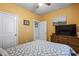 Bright bedroom featuring yellow walls, neutral carpeting, and classic furnishings at 775 Oyster Bluff Dr., Myrtle Beach, SC 29588