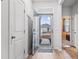 Inviting foyer with hardwood floors, white trim, and a view of the home's exterior through the open door at 775 Oyster Bluff Dr., Myrtle Beach, SC 29588