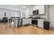 Bright kitchen features granite countertops, stainless steel appliances, and white cabinetry at 775 Oyster Bluff Dr., Myrtle Beach, SC 29588