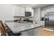 Kitchen featuring granite countertops, stainless steel appliances, and white cabinets at 775 Oyster Bluff Dr., Myrtle Beach, SC 29588
