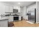 Bright kitchen features granite countertops, stainless steel appliances, and white cabinetry at 775 Oyster Bluff Dr., Myrtle Beach, SC 29588