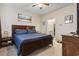 Main bedroom with ceiling fan, carpet, and en-suite bathroom access at 775 Oyster Bluff Dr., Myrtle Beach, SC 29588