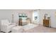 Bedroom with crib, chair, and decorative accents at 8059 Bear Claw Way, Conway, SC 29526