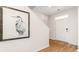Bright entryway with hardwood floors, a large art piece, and a white door at 8059 Bear Claw Way, Conway, SC 29526