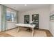 Home office with hardwood floors, built-in shelving, and a desk at 8059 Bear Claw Way, Conway, SC 29526
