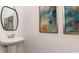 Powder room with pedestal sink and framed art at 8059 Bear Claw Way, Conway, SC 29526