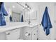 White bathroom with shower and updated fixtures at 100 Ocean Creek Dr. # F-1, Myrtle Beach, SC 29572