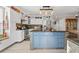 Modern kitchen with white cabinets and blue island at 1010 Pinnacle Ln. # 1010, Myrtle Beach, SC 29577