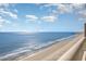 Breathtaking panoramic ocean view and sandy beach visible from a high-rise balcony at 1012 N Waccamaw Dr. # 1204, Garden City Beach, SC 29576