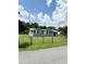 Cute green house with a chain link fence at 109 Plum Ln., Andrews, SC 29510