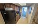 Small galley kitchen with black appliances at 1105 S Ocean Blvd. # 236, Myrtle Beach, SC 29577