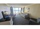 Living room with ocean view and comfortable seating at 1105 S Ocean Blvd. # 236, Myrtle Beach, SC 29577