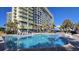 Resort-style pool with plenty of lounge chairs at 1105 S Ocean Blvd. # 236, Myrtle Beach, SC 29577