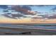 Peaceful beach scene with surfboard and sunset at 1110 Barrington Way, Conway, SC 29526