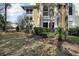 Landscaped backyard with lush greenery and spacious lawn area at 1313 Villa Marbella Ct. # 101, Myrtle Beach, SC 29572