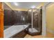 Bathroom with a large walk-in shower and a soaking tub at 1313 Villa Marbella Ct. # 101, Myrtle Beach, SC 29572