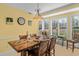 Bright dining room with wood table and large windows at 1313 Villa Marbella Ct. # 101, Myrtle Beach, SC 29572