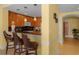 Kitchen with breakfast bar and dark wood cabinetry at 1313 Villa Marbella Ct. # 101, Myrtle Beach, SC 29572