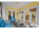 Bright sunroom with access to backyard and living room at 1313 Villa Marbella Ct. # 101, Myrtle Beach, SC 29572