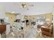 Open concept dining area with glass-top table and view of kitchen and living area at 1356 Glenns Bay Rd. # E 204, Surfside Beach, SC 29575