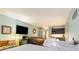 This wide shot shows two beds, a kitchenette, and a TV in the room at 1501 S Ocean Blvd. # 811, Myrtle Beach, SC 29577