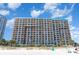 Oceanfront resort with multiple balconies, palm trees, and direct beach access, promising a luxurious stay at 1501 S Ocean Blvd. # 811, Myrtle Beach, SC 29577