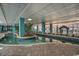 Relax in the indoor pool area with decorative landscaping and seating at 1501 S Ocean Blvd. # 811, Myrtle Beach, SC 29577