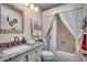 Bathroom features a vanity, toilet, and shower with curtain at 1579 Southwood Dr., Surfside Beach, SC 29575