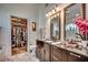 Bathroom features double vanity, granite counters, and large mirror at 1579 Southwood Dr., Surfside Beach, SC 29575