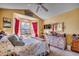 Bright bedroom with a bay window, ceiling fan, and cottage furniture at 1579 Southwood Dr., Surfside Beach, SC 29575