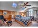 Bedroom featuring wood paneling, skylights, a ceiling fan, and carpeted floors at 1579 Southwood Dr., Surfside Beach, SC 29575