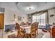 Formal dining room with elegant chandelier, seating for six, and natural light at 1579 Southwood Dr., Surfside Beach, SC 29575