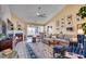 Spacious living room with a fireplace, ample natural light, and neutral décor at 1579 Southwood Dr., Surfside Beach, SC 29575