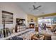 Cozy living room with a fireplace and large windows, perfect for relaxation at 1579 Southwood Dr., Surfside Beach, SC 29575