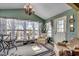 Inviting sunroom with large windows, comfortable seating, and ample natural light at 1579 Southwood Dr., Surfside Beach, SC 29575