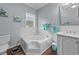 Bathroom with corner soaking tub and separate shower at 166 Harvest Moon Dr., Longs, SC 29568